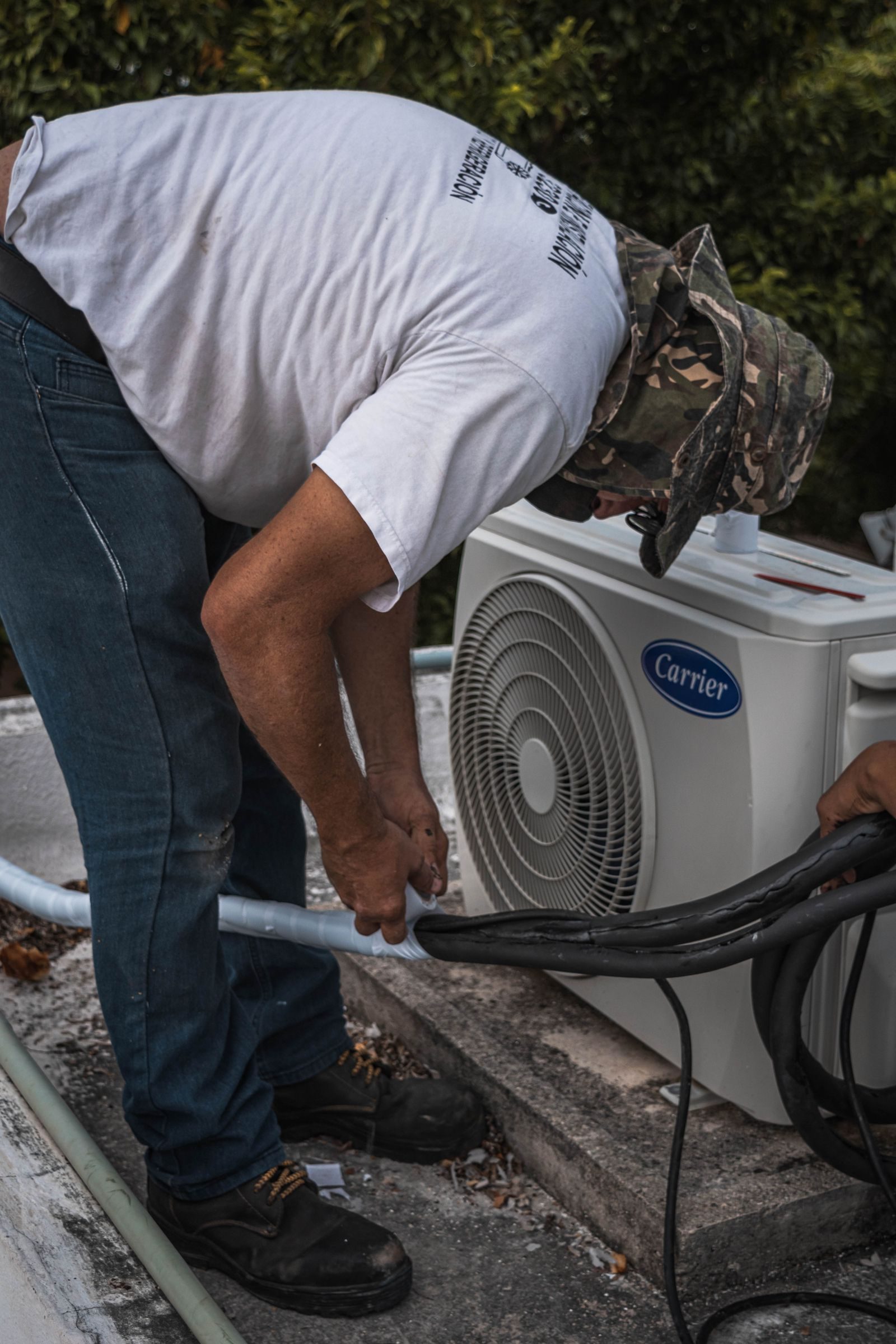 New outdoor condensing unit installed beside a home