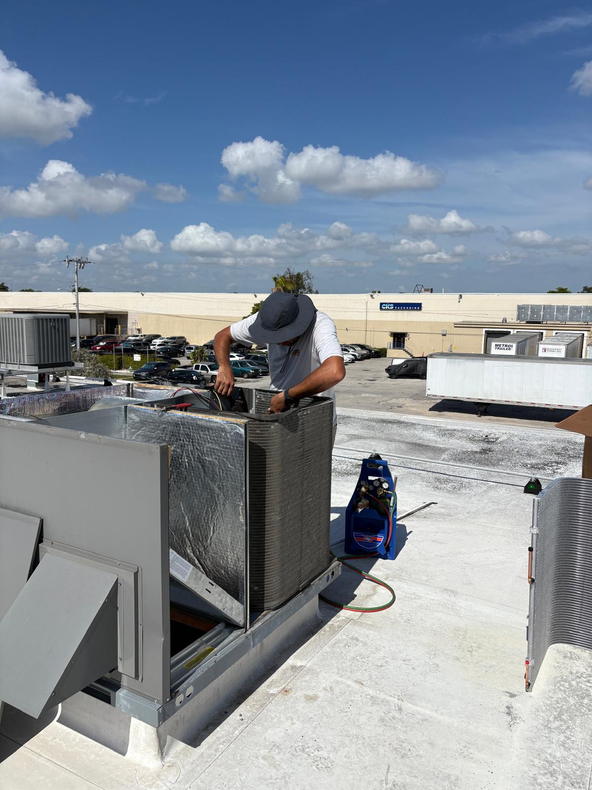 Commercial rooftop units serviced under a maintenance agreement.