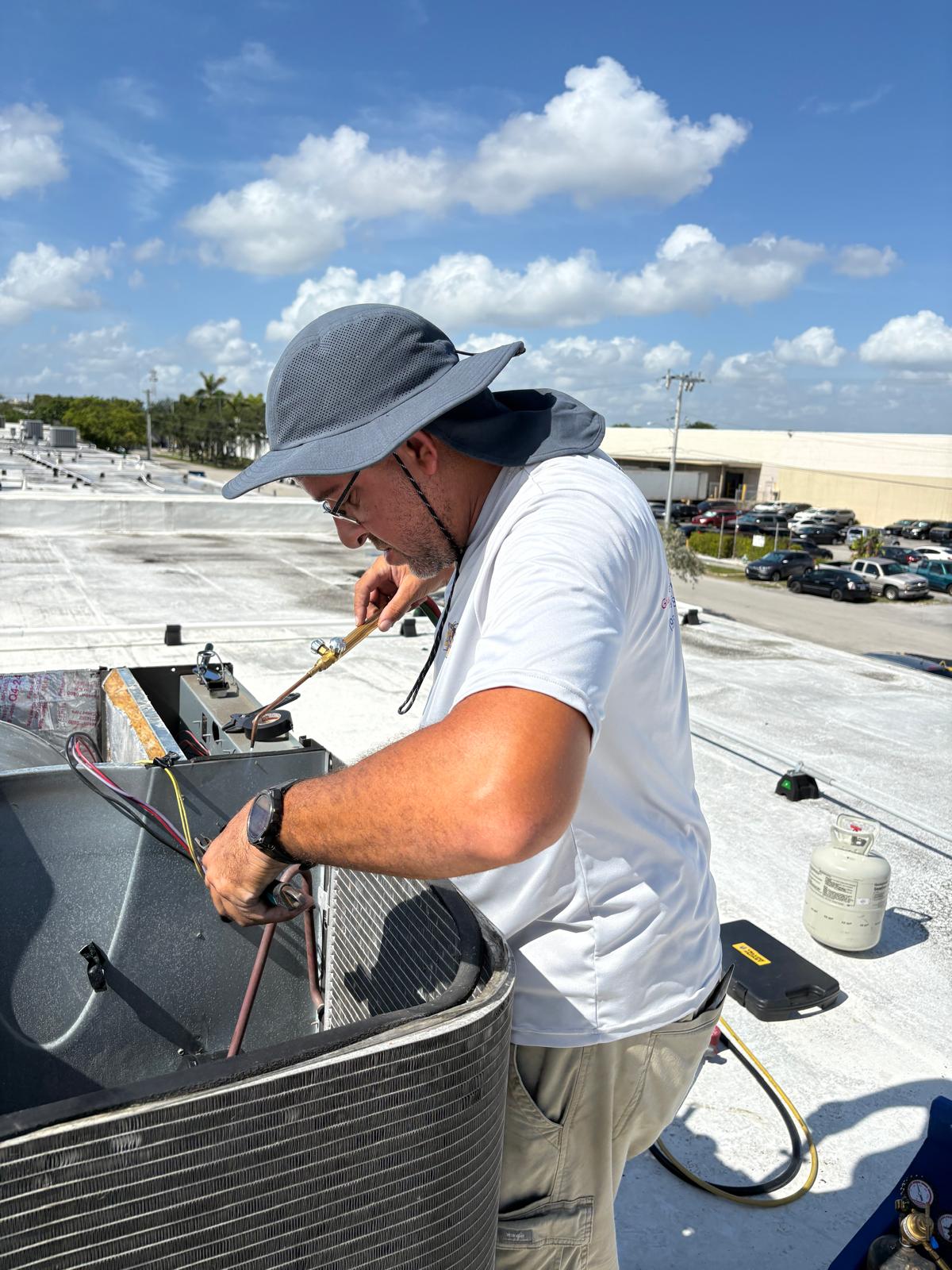 Brazing a refrigerant line set during a system replacement.